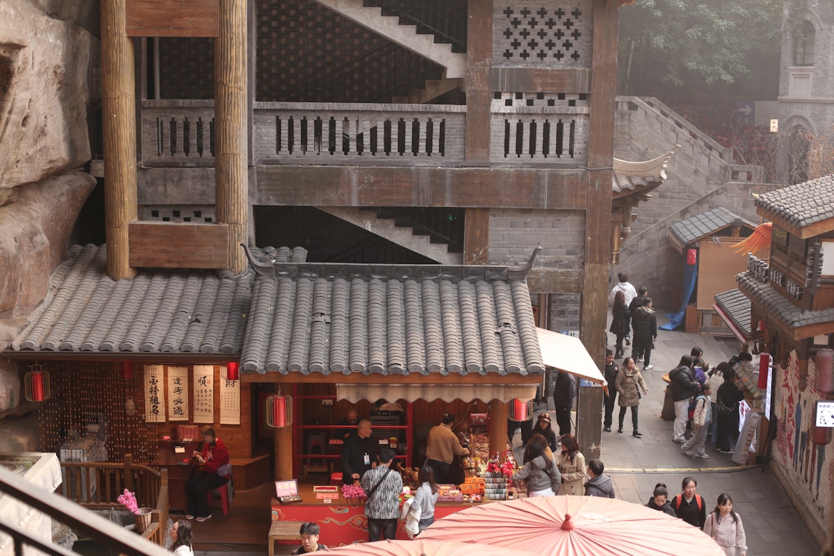 Travellers exploring a lively Asian
            street market